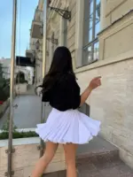 Міні спідниця з шортами та клинами біла