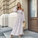 Довга муслінова сукня білого кольору в дрібну помаранчеву квітку