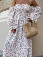 Довга муслінова сукня білого кольору в дрібну помаранчеву квітку