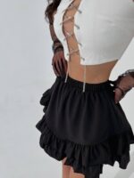 Міні спідниця з рюшами чорного кольору М515