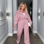 Жіночий трикотажний костюм кофта на блискавці та штани палаццо кольору пудра 00523