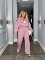Жіночий трикотажний костюм кофта на блискавці та штани палаццо кольору пудра 00523