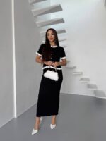 Жіночий костюм з контрастним оздобленням чорного кольору